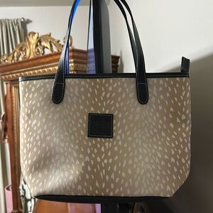 Brand new vinyl mini bag.
